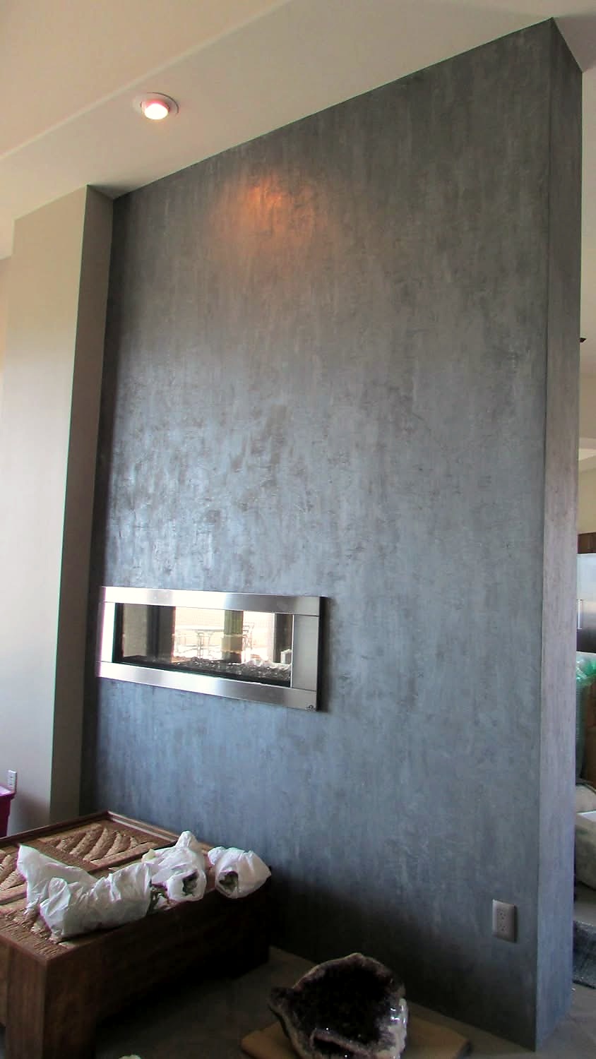 Grey metallic plaster fireplace feature wall