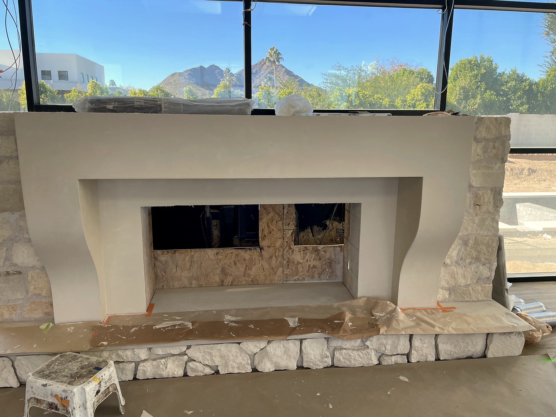 Roman clay fireplace surround under construction