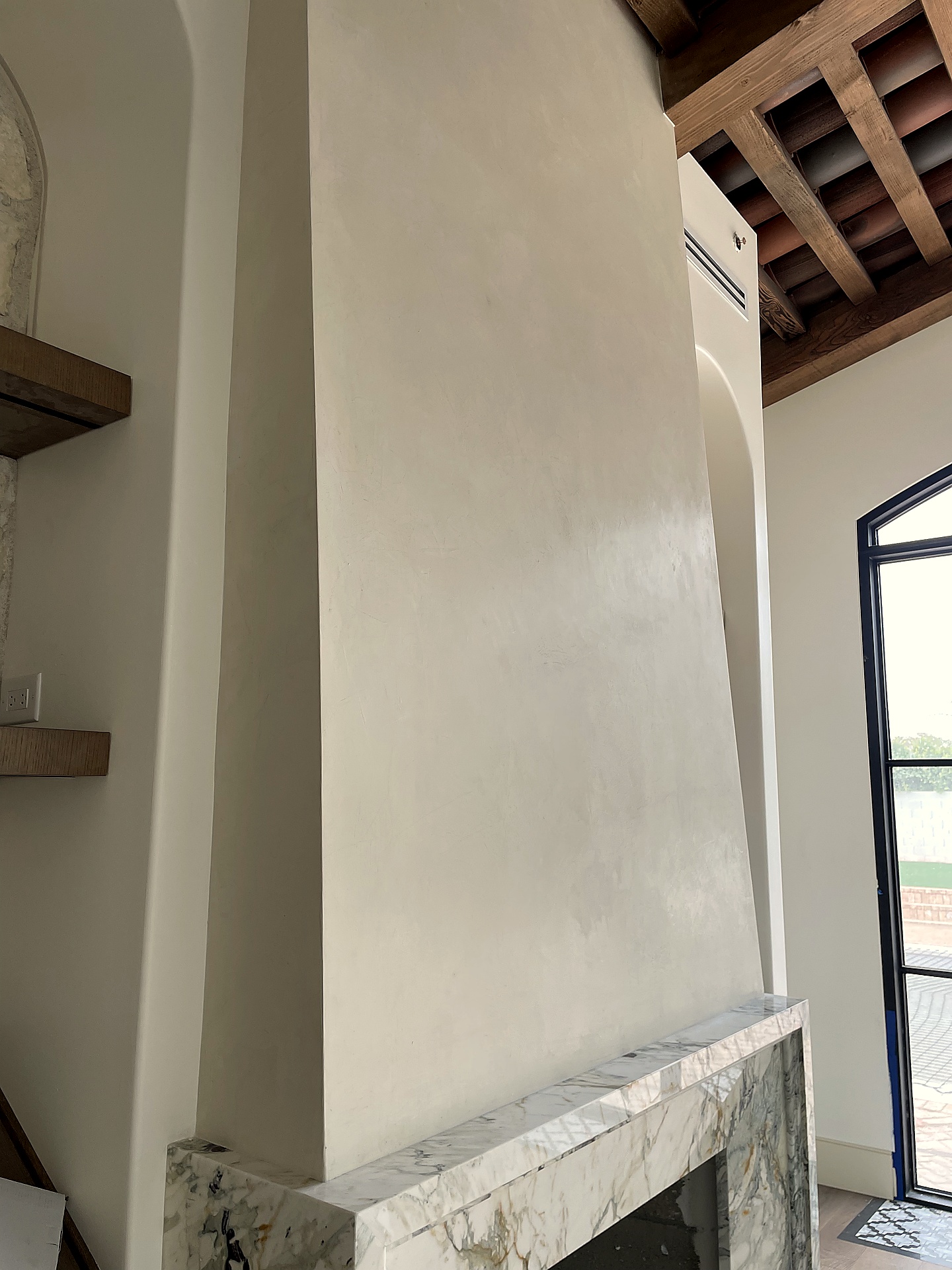 Roman clay plaster fireplace surround detail