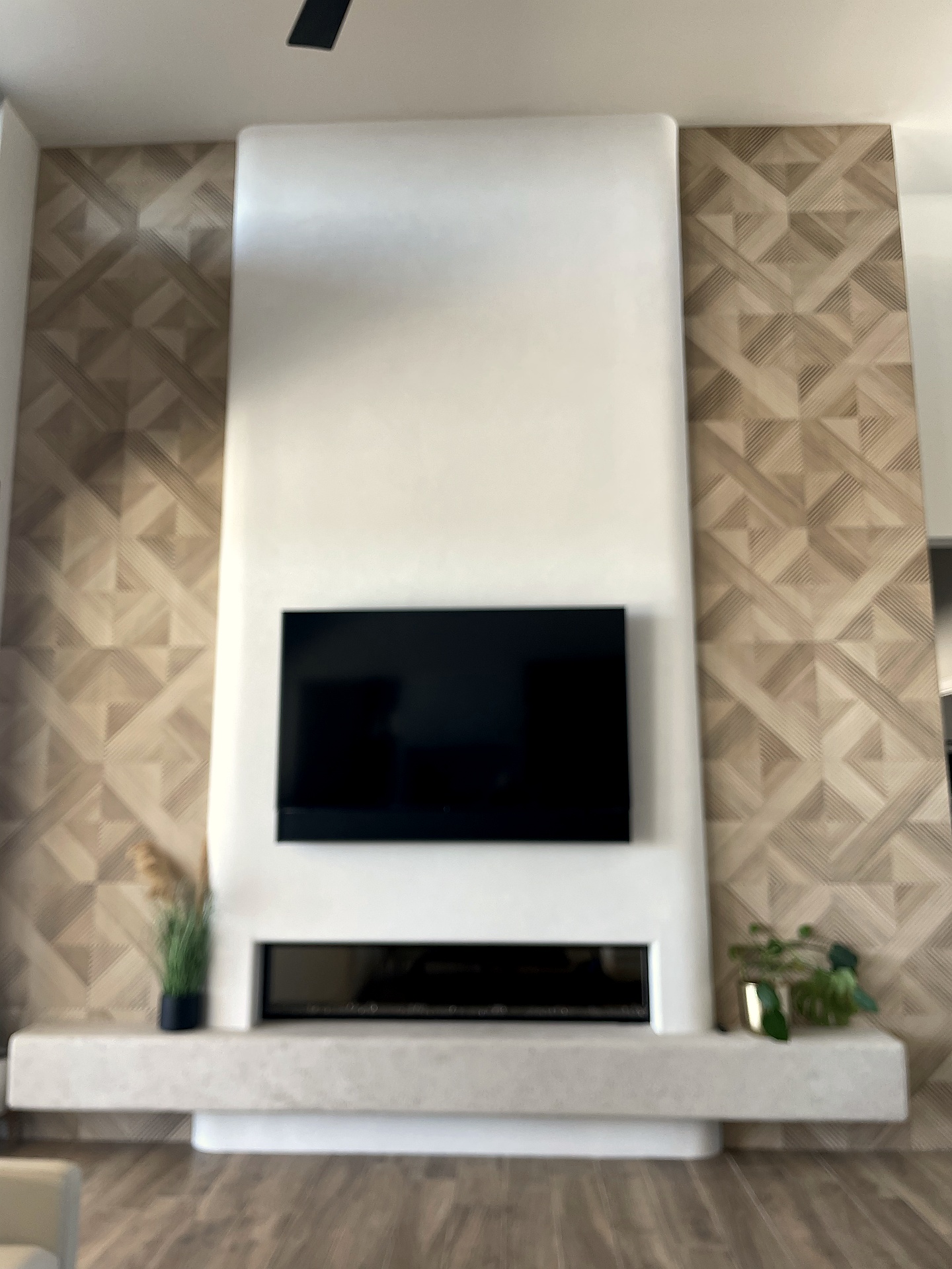 White Tadelakt plaster feature wall with fireplace
