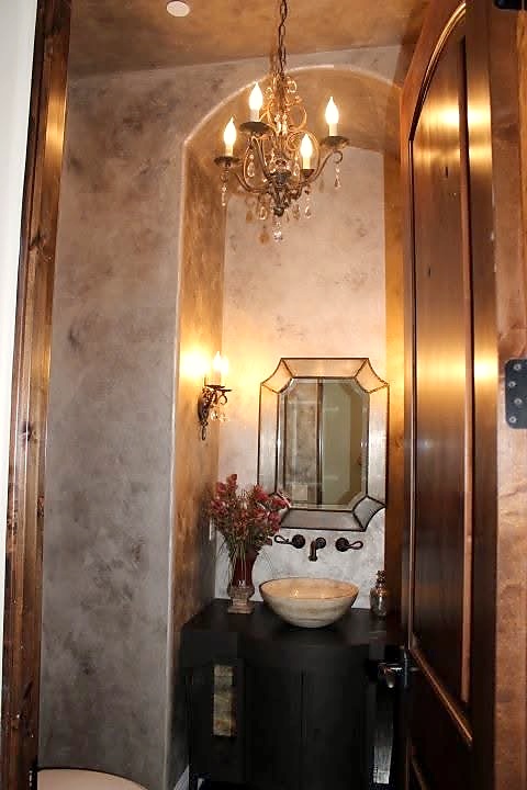 Venetian plaster powder room with chandelier